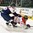 GRAND FORKS, NORTH DAKOTA - APRIL 18: Slovakia's Rastislav Vaclav #18 knocks down Canada's Dante Fabro #4 during preliminary round action at the 2016 IIHF Ice Hockey U18 World Championship. (Photo by Minas Panagiotakis/HHOF-IIHF Images)

